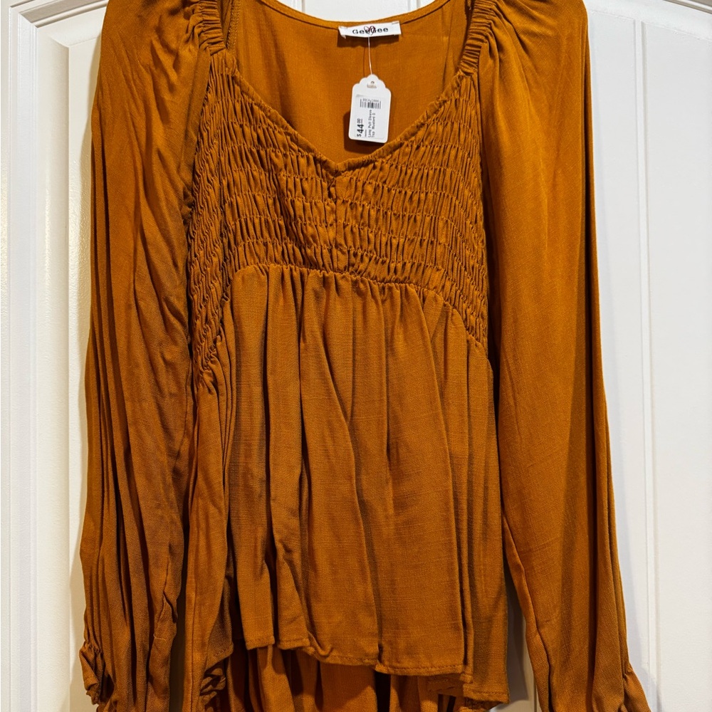 Smocked Peasant Blouse in Rust Orange by Free People